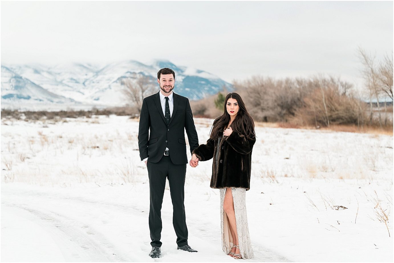 Winter engagement session Yakima Photographer Joel and Jaclyn bride in sequin dress in the snow by the river