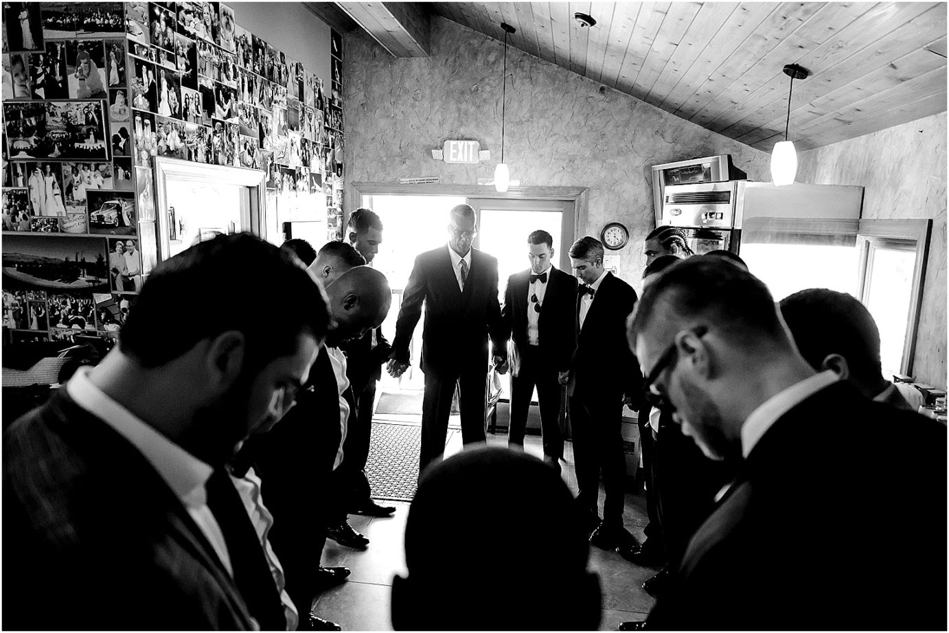 Karma Vineyards Wedding Chelan Photographer Mansel and Rita groom and groomsmen praying