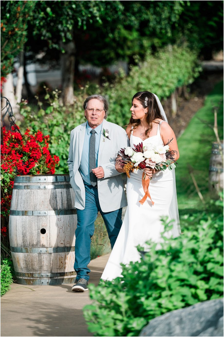 Karma Vineyards Wedding Chelan Photographer Mansel and Rita bride and her dad loading the trolley