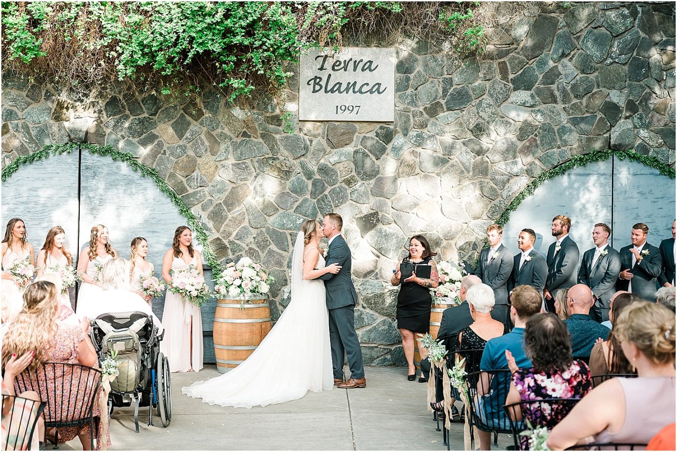 Bride and groom first kiss for wedding at Terra Blanca Winery