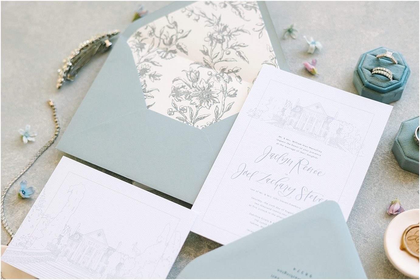 Disney-inspired Oakshire Estate Wedding invitation suite with dusty blue envelope