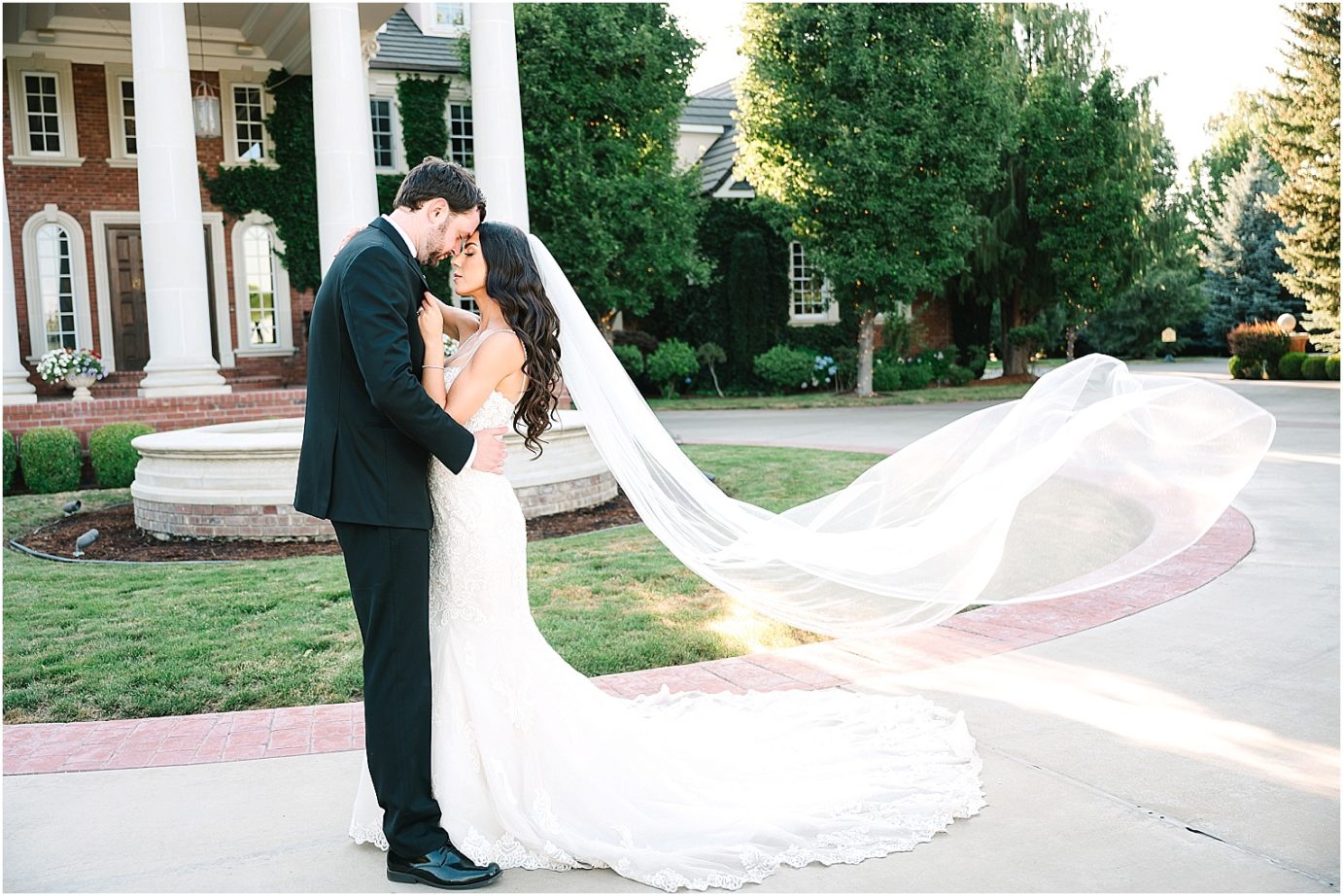 Disney-inspired Oakshire Estate Wedding bride and groom with veil shot