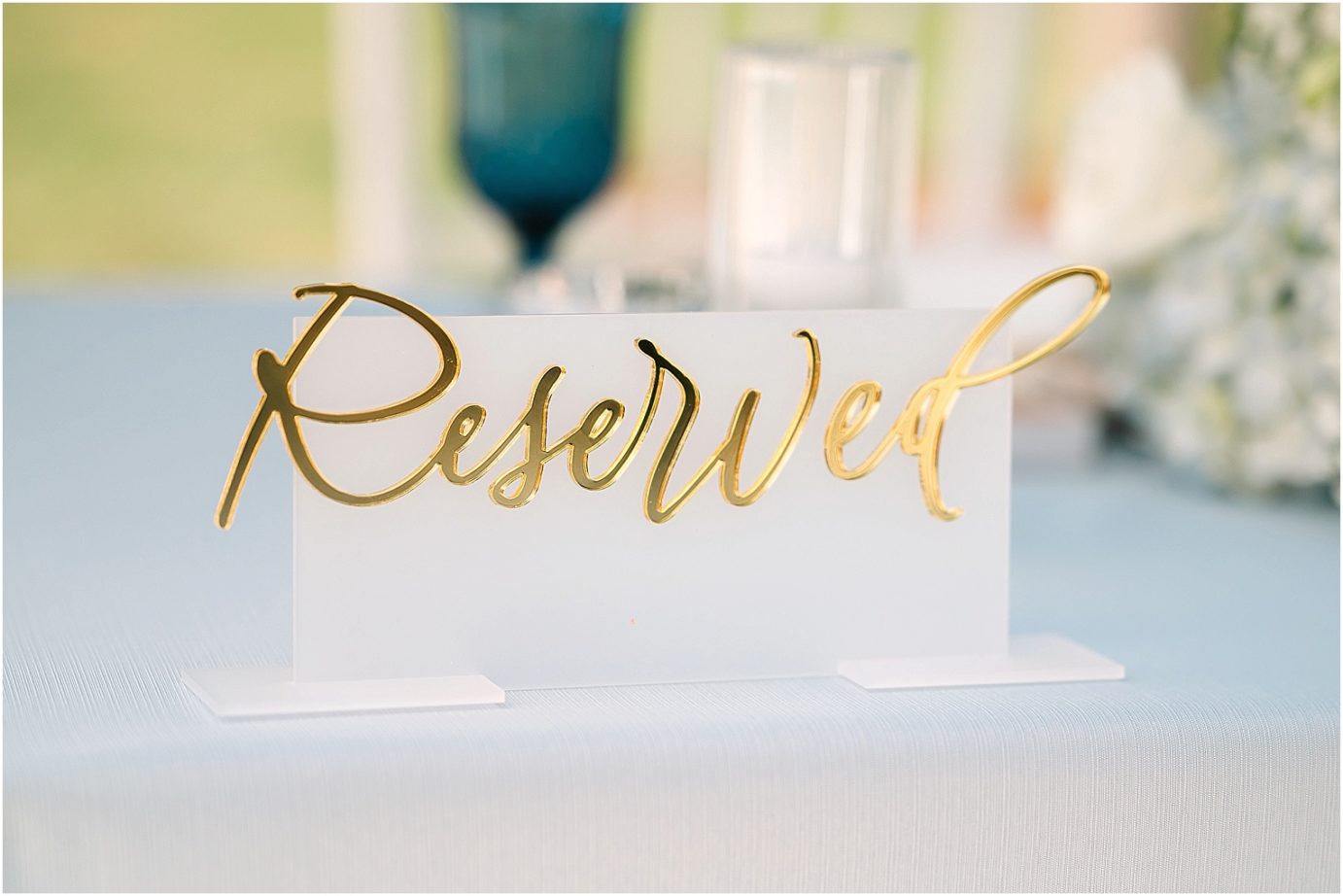Disney-inspired Oakshire Estate Wedding table signage by Carly Allred Studio