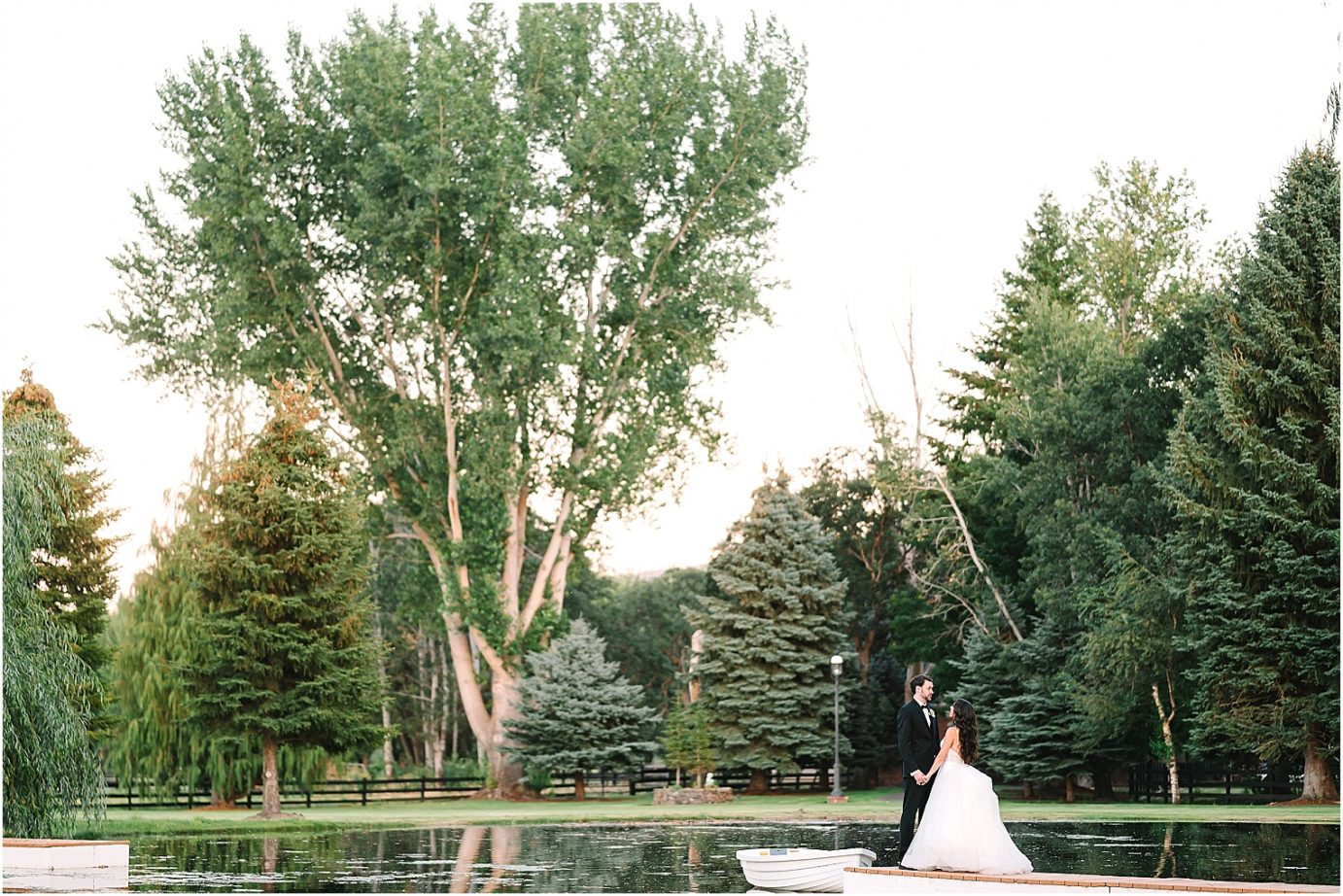 Disney-inspired Oakshire Estate Wedding sunset photos with couple by the pond