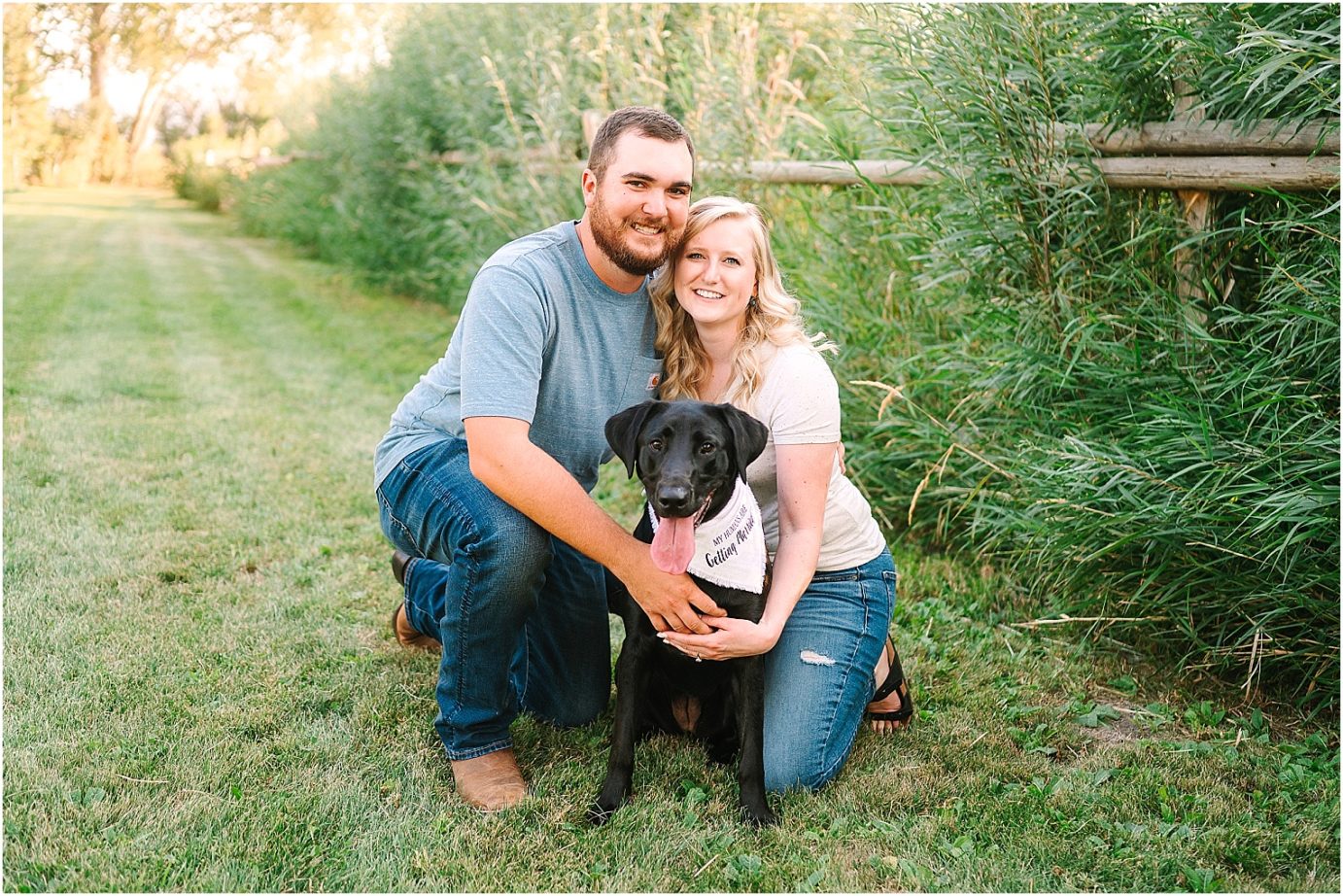 couple and their dog during their garden engagement session