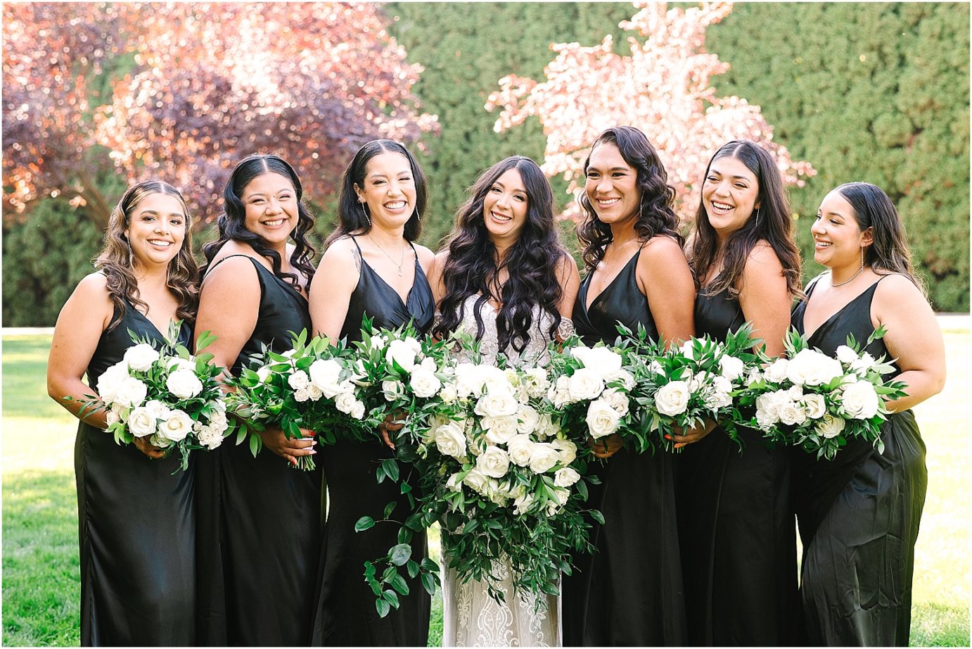 Wedding at Promise Garden bride with bridesmaids in black dresses