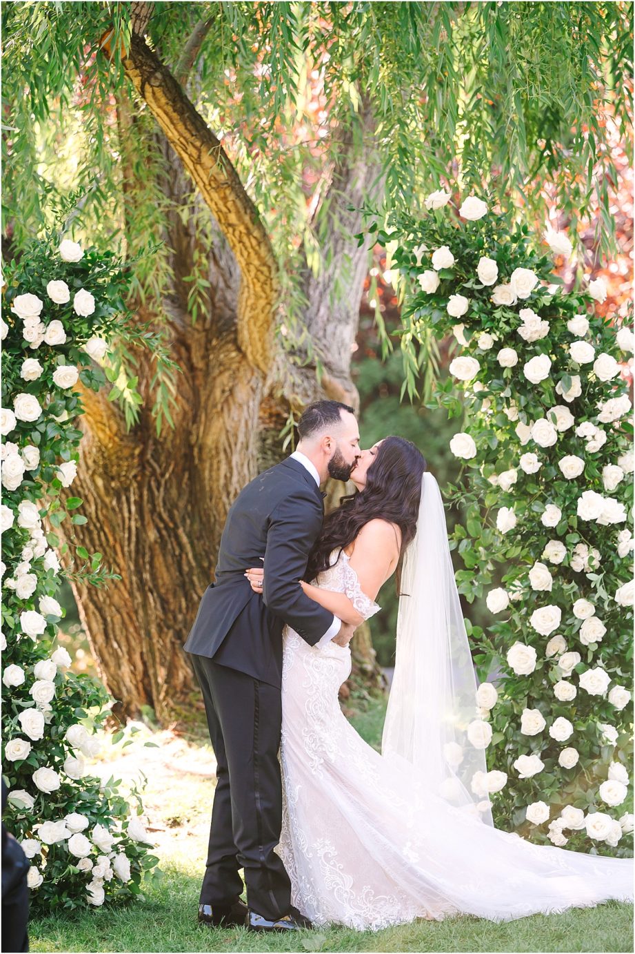Wedding at Promise Garden bride and groom first kiss 