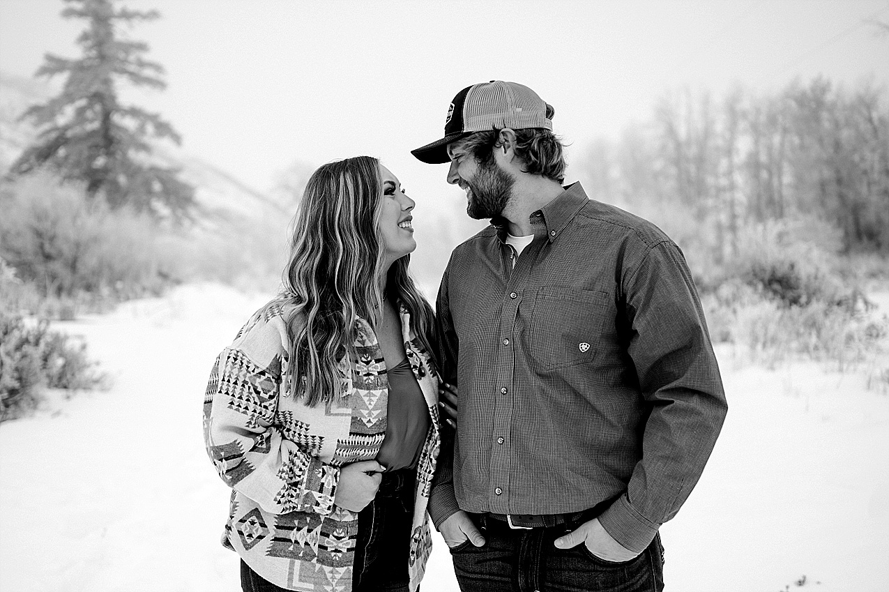 Snowy ellensburg engagement session couple hugging in the snow