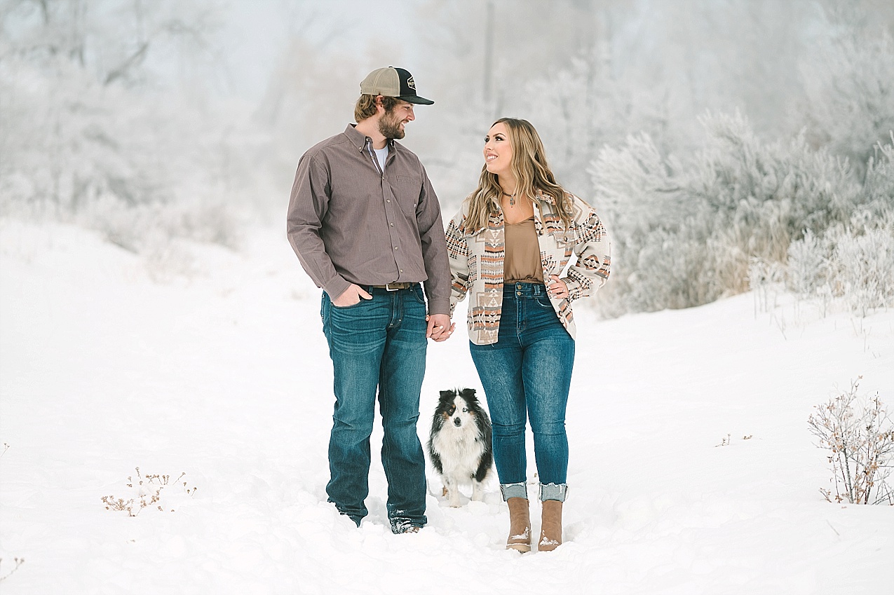 Snowy ellensburg engagement session couple in the snow with their aussie
