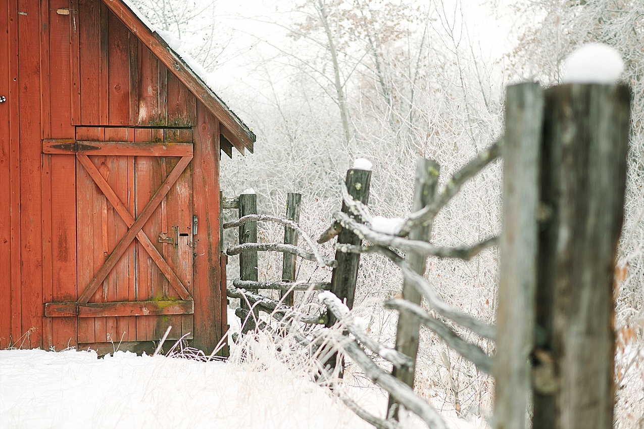Snowy Ellensburg engagement session Photo of a fence next to a red barn