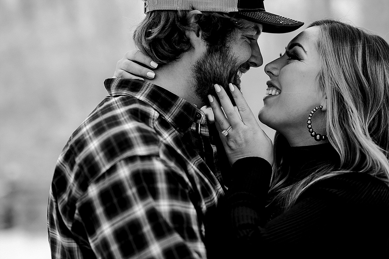 Snowy Ellensburg engagement session couple about to kiss in the snow