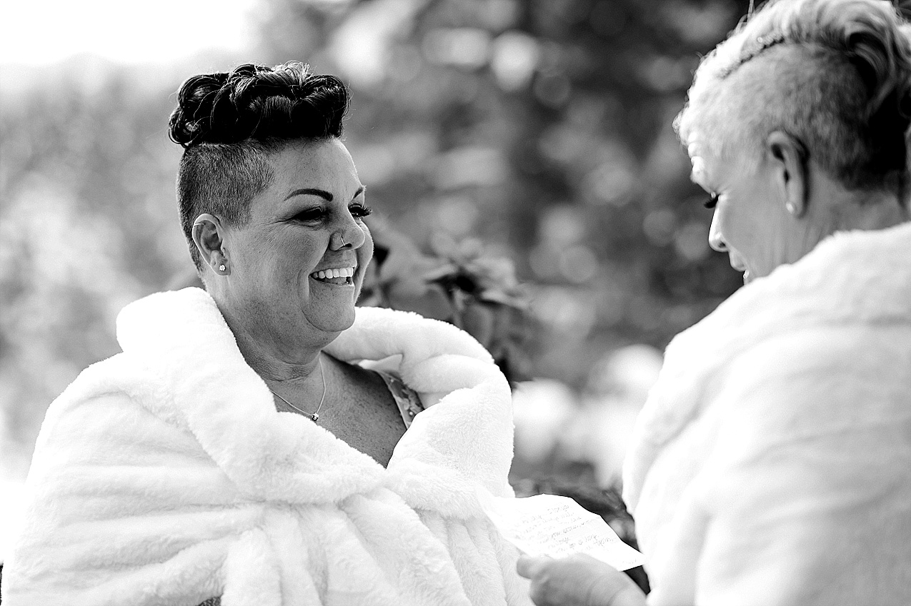 Wintery Pine River Ranch wedding brides sharing their vows