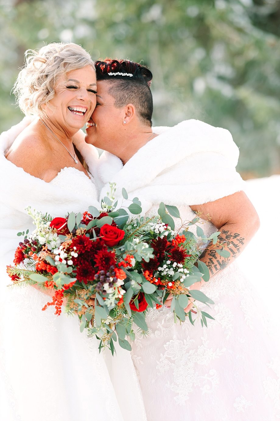 Wintery Pine River Ranch Wedding bride with maroon and green flowers