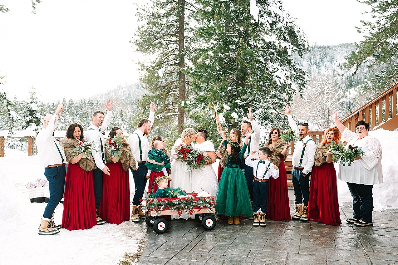 Wintery Pine River Ranch Wedding wedding party with maroon and green flowers