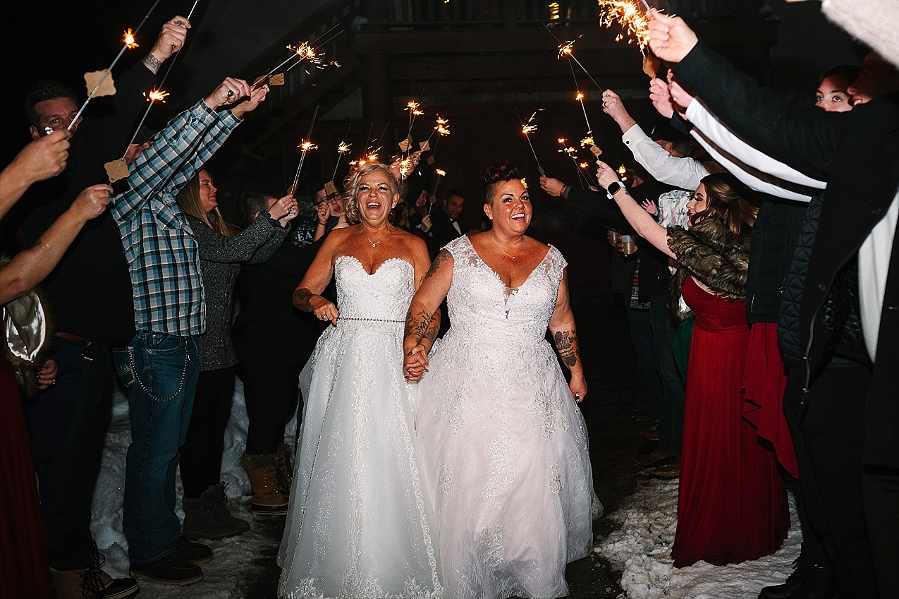 Wintery Pine River Ranch Wedding sparkler exit in the snow