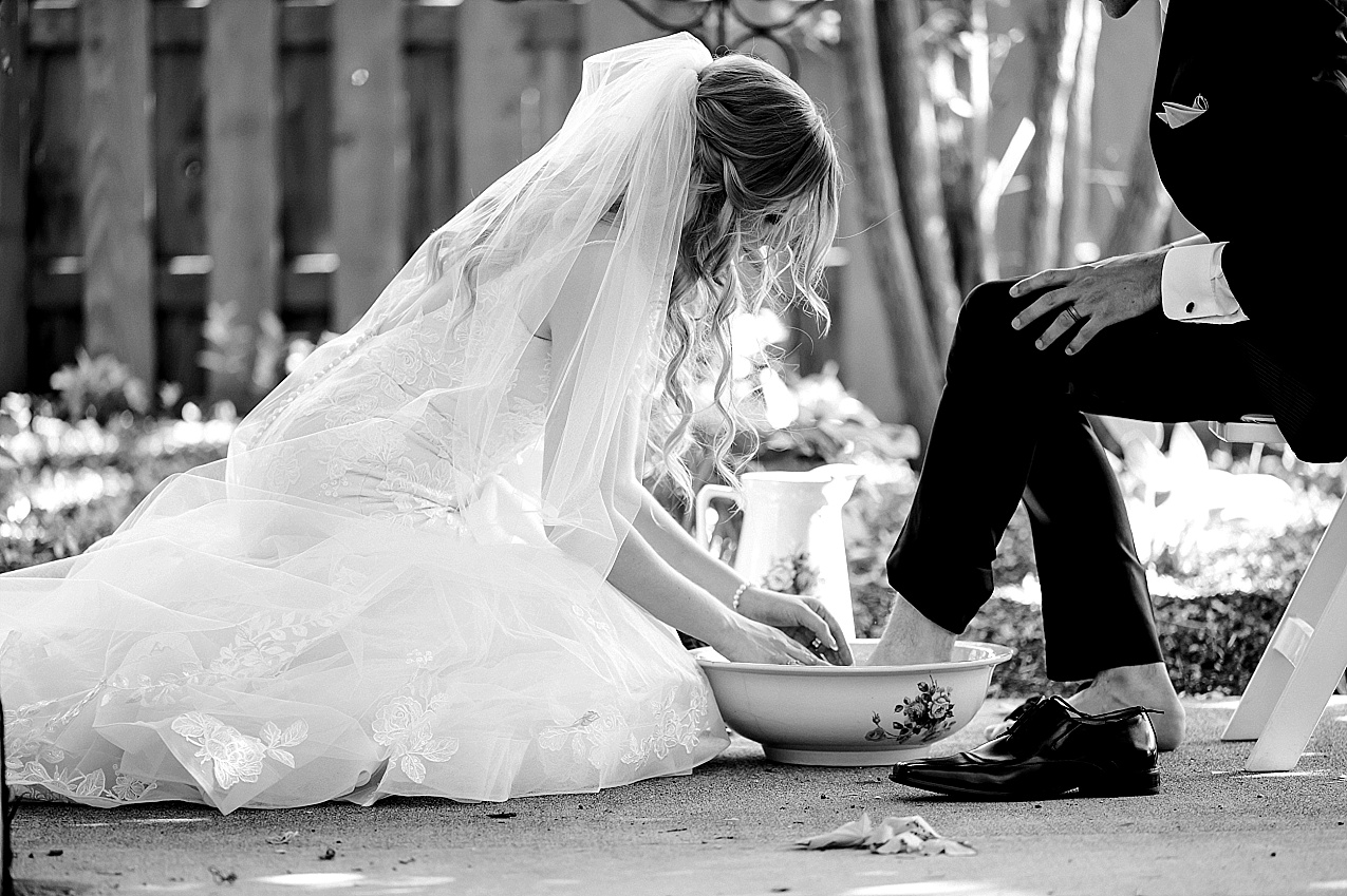 Creekstone Gardens Wedding Walla Walla bride and groom doing a foot washing ceremony