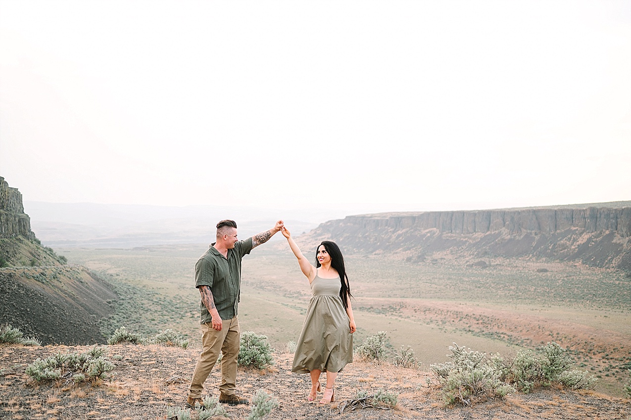 Eastern Washington engagement session Nathan and Ashley dancing on the side of the road