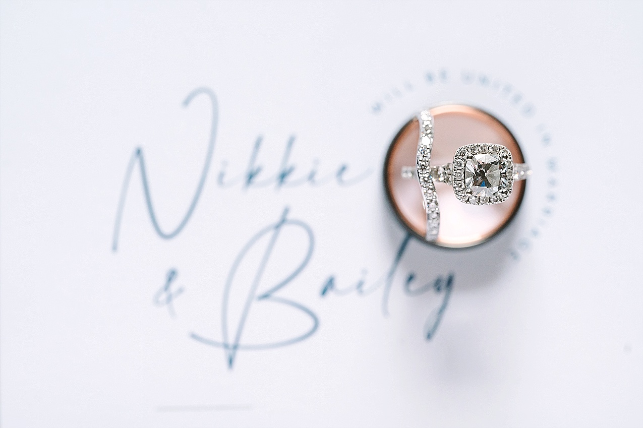 American Homestead Wedding Naches Photographer Bailey and Nikkie invitation suite and ring shot