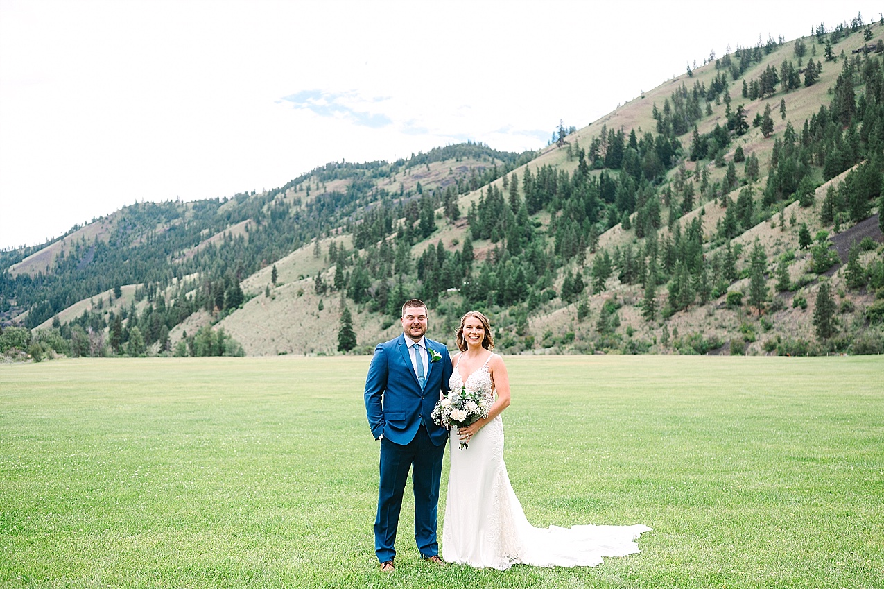 American Homestead Wedding Naches Photographer Bailey and Nikkie bride and groom portraits in mountains in background