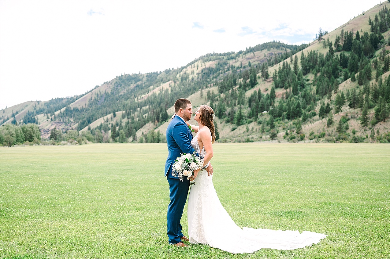 American Homestead Wedding Naches Photographer Bailey and Nikkie bride and groom portraits in mountains in background