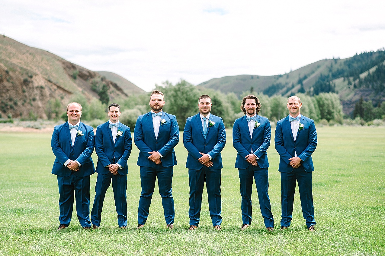 American Homestead Wedding Naches Photographer Bailey and Nikkie groom with groomsmen in navy tuxes