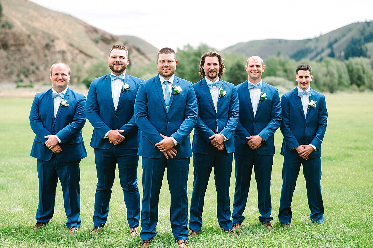 American Homestead Wedding Naches Photographer Bailey and Nikkie groom with groomsmen in navy tuxes