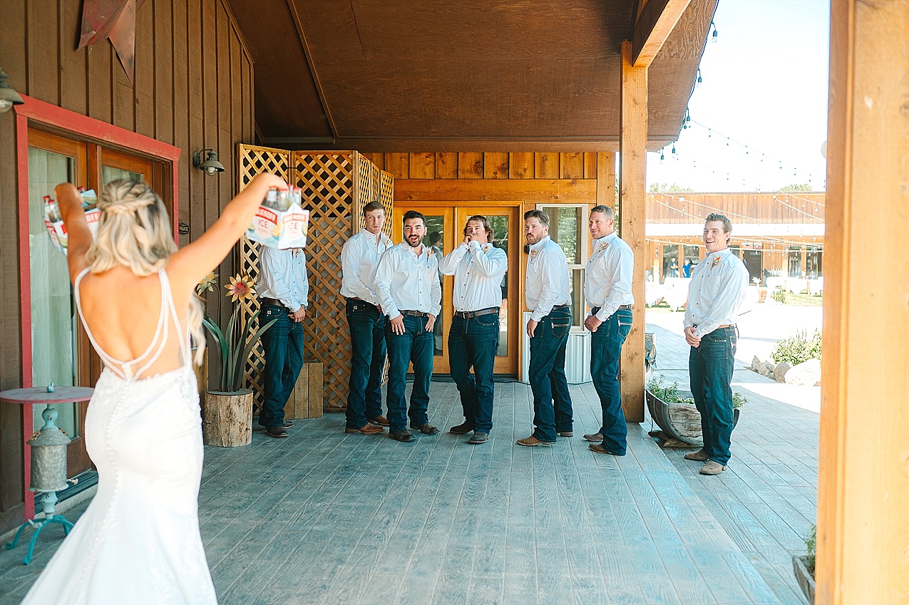 McIntosh Ranch Wedding Ellensburg WA Blake and Korteney bride ices the groomsmen
