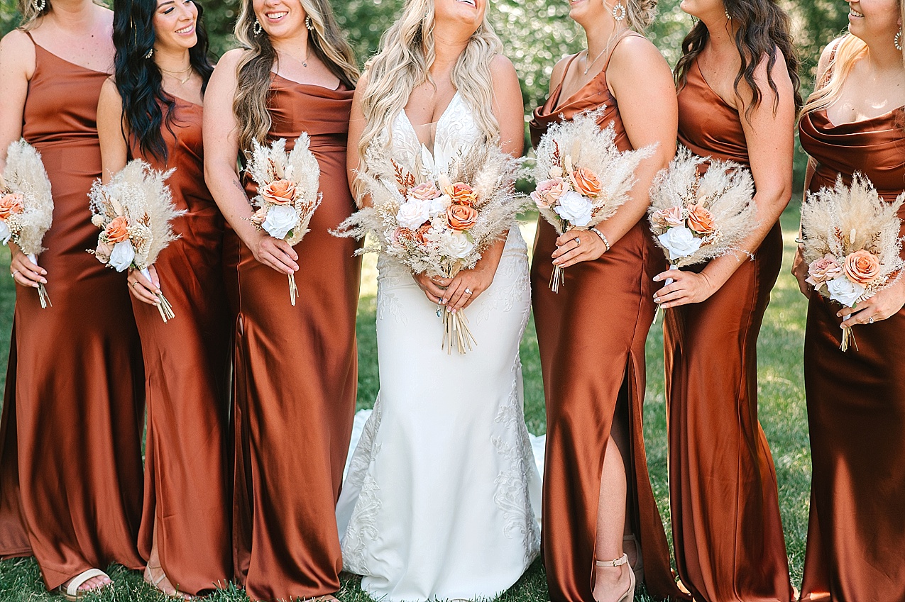 McIntosh Ranch Wedding Ellensburg WA Blake and Korteney bridesmaids in rust colored dresses