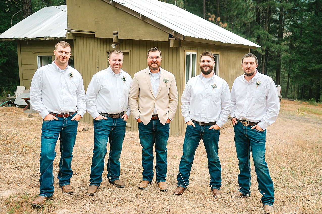 The Cattle Barn Wedding Ellensburg WA Andrew and Dani groom and groomsmen at family cabin