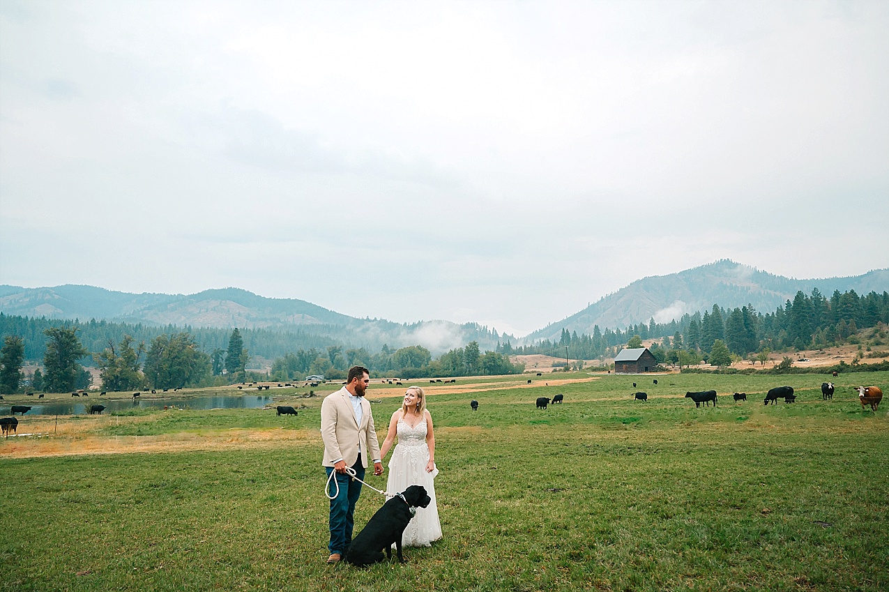 The Cattle Barn Wedding Ellensburg WA Andrew and Dani Sunset portraits with their dog