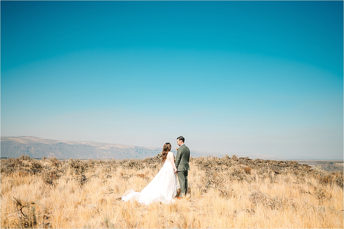 Colorful Two Point Ranch Wedding Soap Lake WA Kirin and Cindy bride and groom overlooking coulee